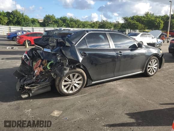 2014 Toyota Camry XLE with VIN 4T1BK1FKXEU545233, listed as a Copart auction lot 90062335 with 142,633 mi miles and Salvage title. Bid and sale history available at DreamBid. Image 3.