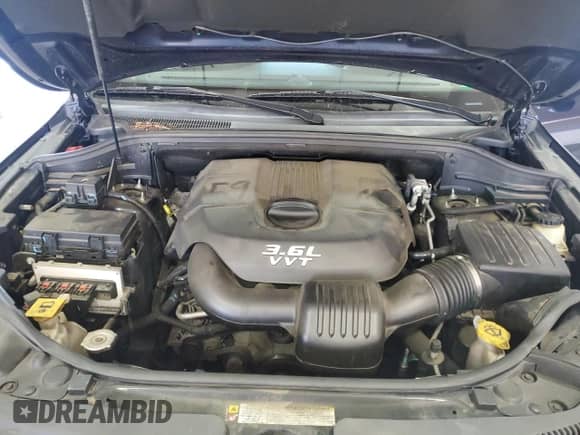 2012 Jeep Grand Cherokee Limited z VIN 1C4RJFBG8CC292498, wystawiony jako Copart lot #71521035 z przebiegiem 167 955 mil mil oraz Szkoda całkowita • Salvage title. Historia ofert i sprzedaży dostępna na DreamBid. Obrazek 12.