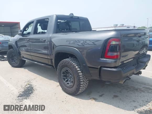 2021 Ram 1500 TRX with VIN 1C6SRFU99MN830292, listed as a IAAI auction lot 42449971 with 48,931 mi miles and . Bid and sale history available at DreamBid. Image 3.