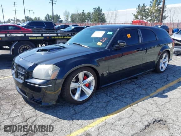 2007 Dodge Magnum SRT-8 z VIN 2D4GV773X7H654618, wystawiony jako IAAI lot #41752289 z przebiegiem 103 819 mil mil oraz . Historia ofert i sprzedaży dostępna na DreamBid. Obrazek 22.