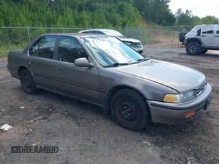 1993 Honda Accord LX z VIN JHMCB7658PC052390, wystawiony jako IAAI lot #43007376 z przebiegiem 276 373 mil mil oraz . Historia ofert i sprzedaży dostępna na DreamBid. Obrazek 1.