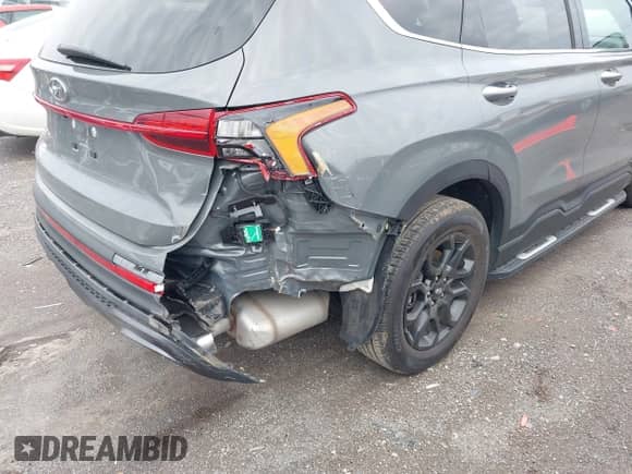 2022 Hyundai Santa Fe XRT with VIN 5NMS64AJ9NH403536, listed as a IAAI auction lot 41599114 with 15,585 mi miles and . Bid and sale history available at DreamBid. Image 6.