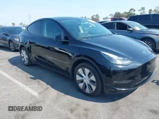 2023 Tesla Model Y z VIN 7SAYGDED9PF947859, wystawiony jako IAAI lot #42959919 z przebiegiem 29 661 mil mil oraz . Historia ofert i sprzedaży dostępna na DreamBid. Obrazek 1.