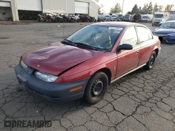 1999 Saturn SL with VIN 1G8ZH5286XZ192072, listed as a Copart auction lot 80973254 with 254,855 mi miles and Salvage title. Bid and sale history available at DreamBid. Image 2.