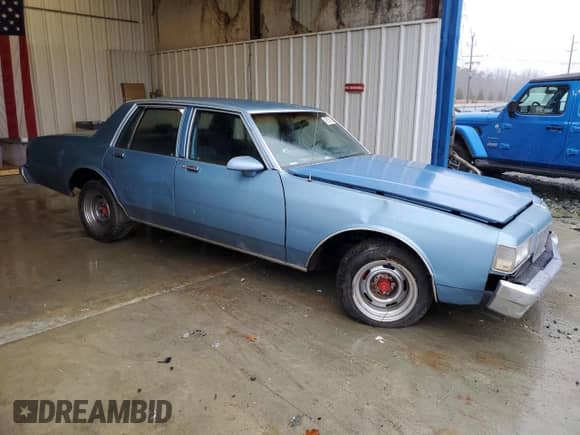 1988 Chevrolet Caprice с VIN 1G1BL51H4JA107607, выставлен на аукционе Copart как лот 43505345 с пробегом 61 354 миль миль и Списание • Salvage title. История ставок и продаж доступна на DreamBid. Изображение 4.