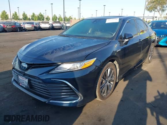 2021 Toyota Camry Hybrid XLE with VIN 4T1F31AK9MU547267, listed as a IAAI auction lot 42732726 with 106,937 mi miles and . Bid and sale history available at DreamBid. Image 2.