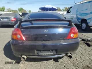 2004 Hyundai Tiburon GT с VIN KMHHN65FX4U108253, выставлен на аукционе Copart как лот 77635034 с пробегом 34 170 миль миль и Списание • Salvage title. История ставок и продаж доступна на DreamBid. Изображение 6.