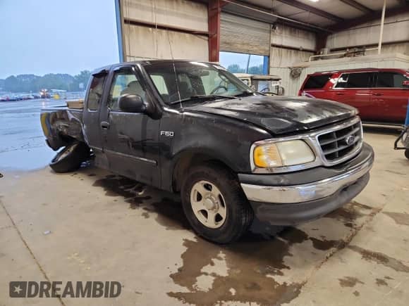 2003 Ford F-150 XL with VIN 2FTRX172X3CA42415, listed as a Copart auction lot 70556985 with 227,798 mi miles and Clean title. Bid and sale history available at DreamBid. Image 4.