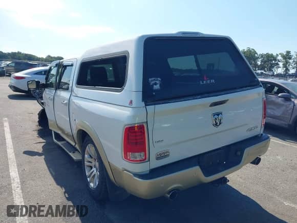 2014 Ram 1500 Longhorn z VIN 1C6RR7PT7ES368846, wystawiony jako IAAI lot #43137351 z przebiegiem 142 136 mil mil oraz . Historia ofert i sprzedaży dostępna na DreamBid. Obrazek 3.