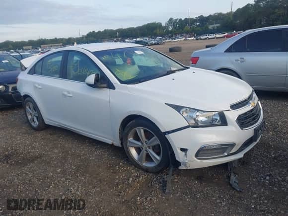 2015 Chevrolet Cruze LT z VIN 1G1PE5SB0F7290972, wystawiony jako IAAI lot #43078116 z przebiegiem Nie podano mil oraz . Historia ofert i sprzedaży dostępna na DreamBid. Obrazek 1.