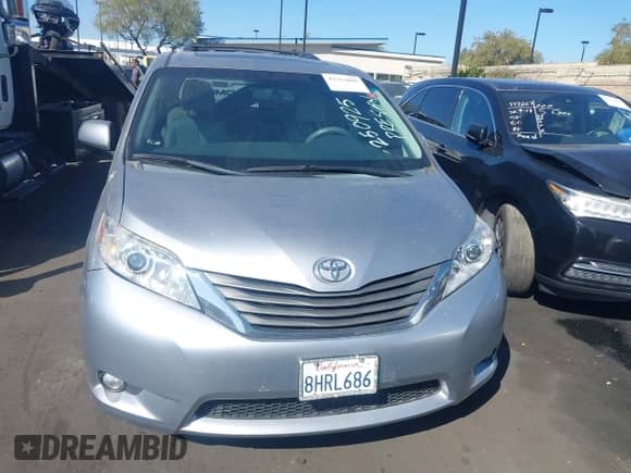 2013 Toyota Sienna XLE with VIN 5TDYK3DC6DS337052, listed as a IAAI auction lot 43353095 with 221,335 mi miles and . Bid and sale history available at DreamBid. Image 13.