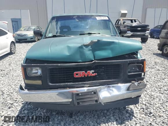 1994 GMC Sierra 1500 with VIN 1GTEC14Z3RZ565959, listed as a Copart auction lot 55407215 with 317,066 mi miles and Salvage title. Bid and sale history available at DreamBid. Image 5.