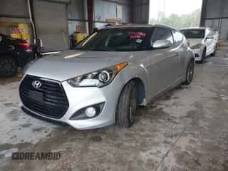 2013 Hyundai Veloster Turbo z VIN KMHTC6AE6DU079671, wystawiony jako IAAI lot #43577765 z przebiegiem 139 477 mil mil oraz . Historia ofert i sprzedaży dostępna na DreamBid. Obrazek 2.