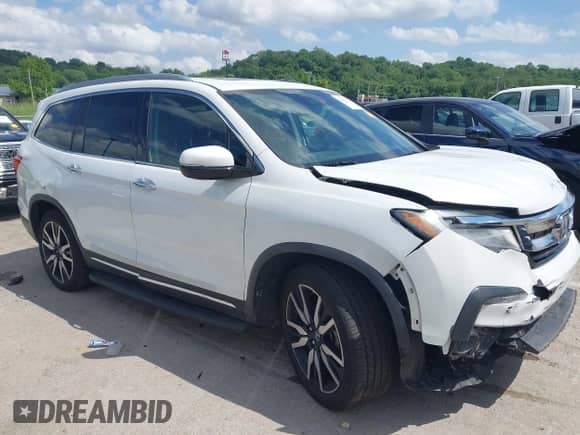 2020 Honda Pilot Touring 7-Passenger z VIN 5FNYF5H65LB021861, wystawiony jako IAAI lot #42305419 z przebiegiem 118 595 mil mil oraz . Historia ofert i sprzedaży dostępna na DreamBid. Obrazek 1.