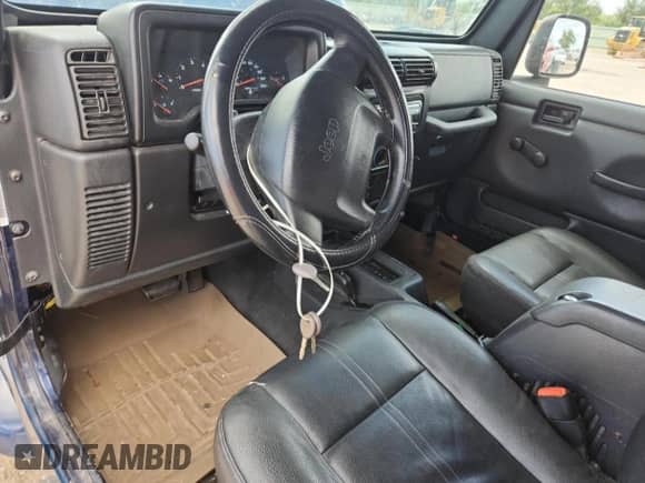 2003 Jeep Wrangler X z VIN 1J4FA39S33P356428, wystawiony jako Copart lot #70285135 z przebiegiem 147 788 mil mil oraz Szkoda całkowita • Salvage title. Historia ofert i sprzedaży dostępna na DreamBid. Obrazek 8.