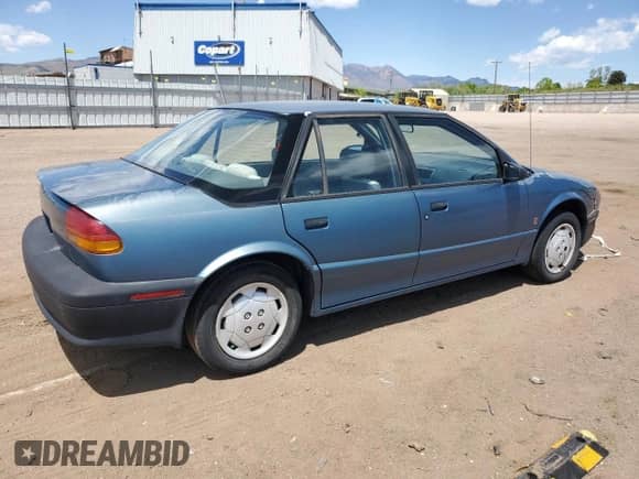 1994 Saturn SL с VIN 1G8ZF559XRZ263772, выставлен на аукционе Copart как лот 58005505 с пробегом 172 362 миль миль и На запчасти • Non repairable. История ставок и продаж доступна на DreamBid. Изображение 3.