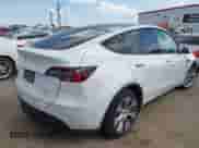 2021 Tesla Model Y Long Range with VIN 5YJYGDEE0MF095080, listed as a IAAI auction lot 42931169 with Not provided miles and . Bid and sale history available at DreamBid. Image 4.