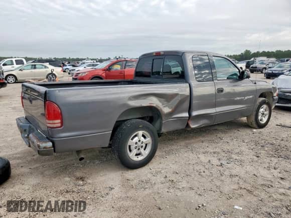 2001 Dodge Dakota z VIN 1B7GL22X91S341785, wystawiony jako Copart lot #90262095 z przebiegiem 164 468 mil mil oraz Szkoda całkowita • Salvage title. Historia ofert i sprzedaży dostępna na DreamBid. Obrazek 3.