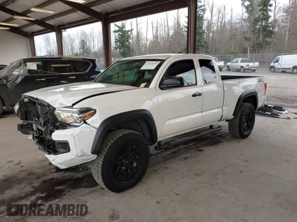 2021 Toyota Tacoma SR with VIN 3TYSZ5AN4MT044869, listed as a IAAI auction lot 41413459 with 62,446 mi miles and . Bid and sale history available at DreamBid. Image 2.
