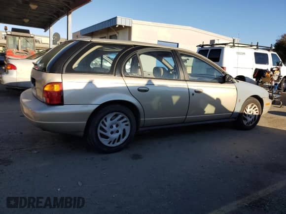 1999 Saturn SW with VIN 1G8ZK8271XZ368987, listed as a Copart auction lot 82610964 with 222,100 mi miles and Clean title. Bid and sale history available at DreamBid. Image 3.