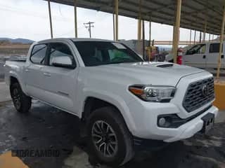 2021 Toyota Tacoma SR with VIN 5TFCZ5AN1MX245882, listed as a IAAI auction lot 42866145 with 109,825 mi miles and . Bid and sale history available at DreamBid. Image 1.