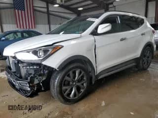 2018 Hyundai Santa Fe Ultimate с VIN 5XYZWDLA8JG556098, выставлен на аукционе Copart как лот 65551915 с пробегом 92 827 миль миль и Списание • Salvage title. История ставок и продаж доступна на DreamBid. Изображение 1.