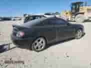 2006 Hyundai Tiburon GS с VIN KMHHM65D16U192869, выставлен на аукционе Copart как лот 47084065 с пробегом 169 919 миль миль и Списание • Salvage title. История ставок и продаж доступна на DreamBid. Изображение 3.