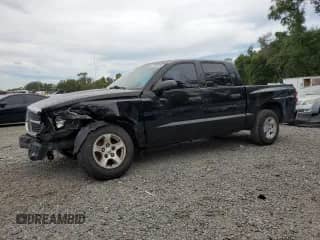 2005 Dodge Dakota SLT with VIN 1D7HE48K05S247795, listed as a Copart auction lot 65764825 with 157,292 mi miles and Salvage title. Bid and sale history available at DreamBid. Image 1.