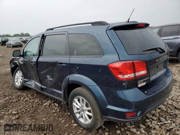 2014 Dodge Journey SXT with VIN 3C4PDDBG9ET182960, listed as a Copart auction lot 63514055 with 125,703 mi miles and Salvage title. Bid and sale history available at DreamBid. Image 2.