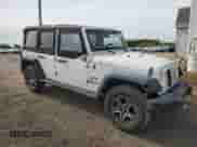 2008 Jeep Wrangler Unlimited X with VIN 1J8GA39158L654942, listed as a Copart auction lot 81987735 with 176,984 mi miles and Clean title. Bid and sale history available at DreamBid. Image 4.