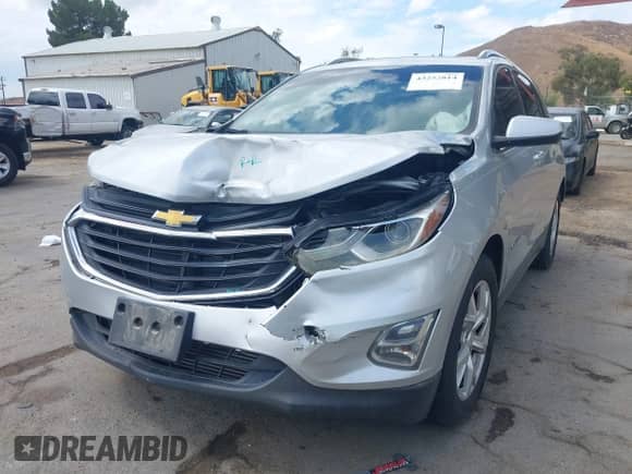 2018 Chevrolet Equinox LT z VIN 2GNAXKEX2J6155117, wystawiony jako IAAI lot #43252814 z przebiegiem 115 406 mil mil oraz . Historia ofert i sprzedaży dostępna na DreamBid. Obrazek 2.