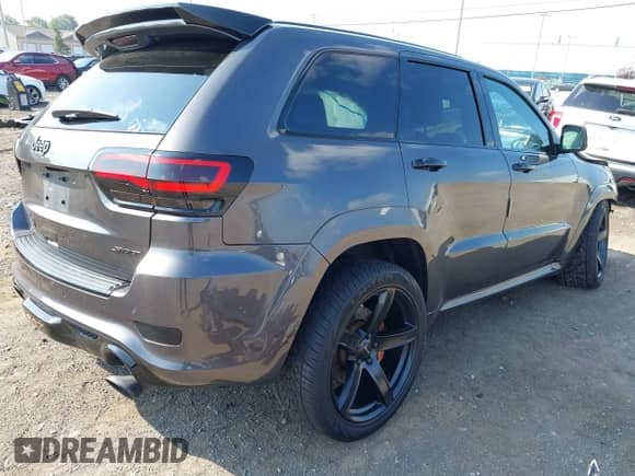 2016 Jeep Grand Cherokee SRT with VIN 1C4RJFDJ7GC359753, listed as a IAAI auction lot 42998753 with 88,855 mi miles and . Bid and sale history available at DreamBid. Image 4.