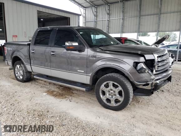 2013 Ford F-150 Lariat with VIN 1FTFW1ET2DFC87796, listed as a Copart auction lot 71112565 with 207,394 mi miles and Salvage title. Bid and sale history available at DreamBid. Image 4.