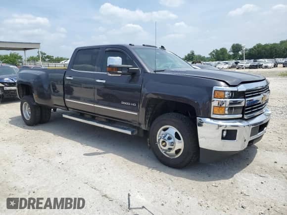 2015 Chevrolet Silverado 3500HD LTZ with VIN 1GC4K0E80FF680420, listed as a Copart auction lot 60500055 with 57,136 mi miles and Salvage title. Bid and sale history available at DreamBid. Image 4.