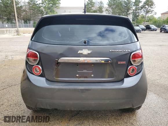 2013 Chevrolet Sonic LTZ with VIN 1G1JE6SB0D4104549, listed as a Copart auction lot 82157005 with 195,547 mi miles and Clean title. Bid and sale history available at DreamBid. Image 6.