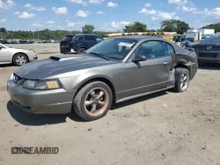 2002 Ford Mustang GT Deluxe с VIN 1FAFP42X42F233053, выставлен на аукционе Copart как лот 70758085 с пробегом 145 923 миль миль и Списание • Salvage title. История ставок и продаж доступна на DreamBid. Изображение 1.