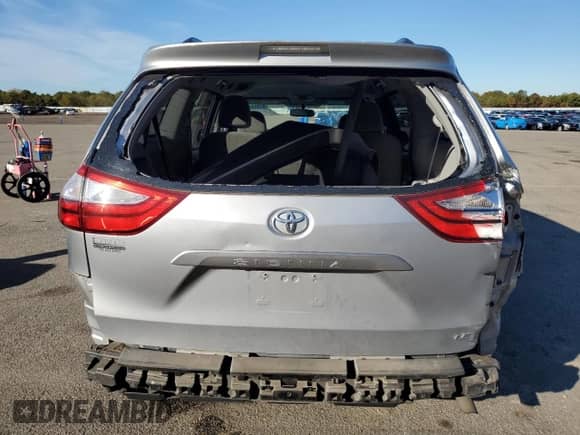 2017 Toyota Sienna LE with VIN 5TDKZ3DC9HS823829, listed as a Copart auction lot 82004525 with 143,268 mi miles and Salvage title. Bid and sale history available at DreamBid. Image 6.