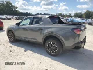 2023 Hyundai Santa Cruz SEL с VIN 5NTJB4AE1PH057774, выставлен на аукционе Copart как лот 77602214 с пробегом 25 938 миль миль и На запчасти • Non repairable. История ставок и продаж доступна на DreamBid. Изображение 2.