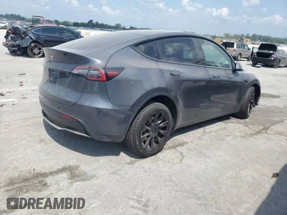 2022 Tesla Model Y Long Range with VIN 7SAYGDEEXNF480795, listed as a Copart auction lot 65829584 with Not provided miles and Salvage title. Bid and sale history available at DreamBid. Image 3.