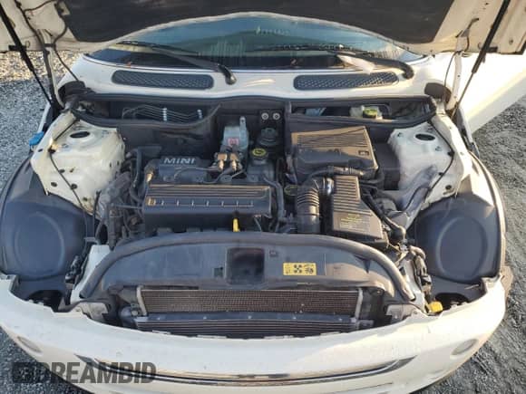 2006 MINI Hardtop with VIN WMWRC33536TK66138, listed as a Copart auction lot 81620335 with 128,877 mi miles and Salvage title. Bid and sale history available at DreamBid. Image 11.