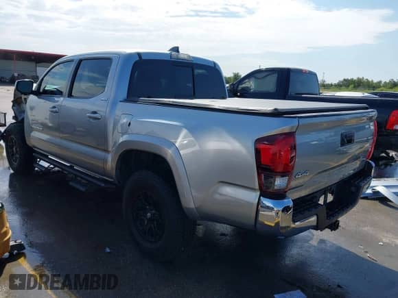 2022 Toyota Tacoma SR5 with VIN 3TMAZ5CN8NM173705, listed as a IAAI auction lot 43084457 with 53,126 mi miles and . Bid and sale history available at DreamBid. Image 3.