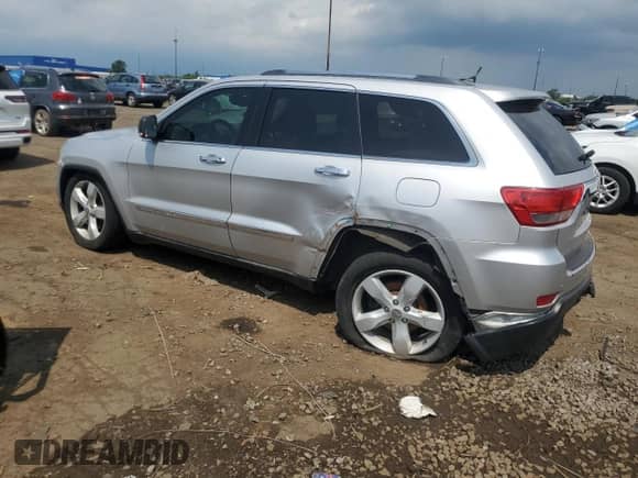 2011 Jeep Grand Cherokee Overland Summit with VIN 1J4RR6GTXBC536210, listed as a Copart auction lot 62634765 with 129,835 mi miles and Salvage title. Bid and sale history available at DreamBid. Image 2.