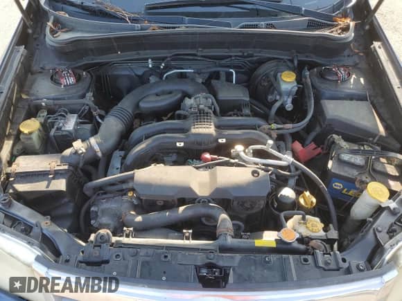 2012 Subaru Forester X z VIN JF2SHABCXCH439051, wystawiony jako Copart lot #68190825 z przebiegiem 198 073 mil mil oraz Szkoda całkowita • Salvage title. Historia ofert i sprzedaży dostępna na DreamBid. Obrazek 12.