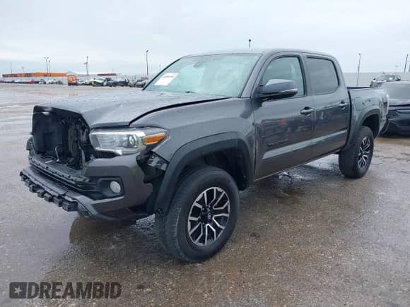 2021 Toyota Tacoma SR5 с VIN 5TFAZ5CNXMX097509, выставлен на аукционе IAAI как лот 41889399 с пробегом 81 598 миль миль и . История ставок и продаж доступна на DreamBid. Изображение 2.