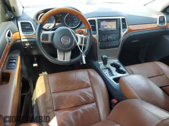 2012 Jeep Grand Cherokee Overland with VIN 1C4RJECG4CC354505, listed as a Copart auction lot 81052135 with 126,523 mi miles and Salvage title. Bid and sale history available at DreamBid. Image 8.