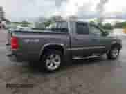 2005 Dodge Dakota SLT z VIN 1D7HW48K55S226972, wystawiony jako Copart lot #54753105 z przebiegiem 144 584 mil mil oraz Szkoda całkowita • Salvage title. Historia ofert i sprzedaży dostępna na DreamBid. Obrazek 3.