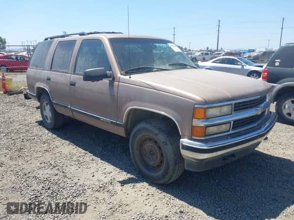 1996 Chevrolet Tahoe with VIN 1GNEK13R9TJ313571, listed as a IAAI auction lot 42768008 with 220,143 mi miles and . Bid and sale history available at DreamBid. Image 1.