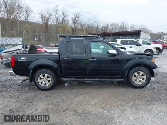 2005 Nissan Frontier SE z VIN 1N6AD07W05C445098, wystawiony jako IAAI lot #41941048 z przebiegiem 276 234 mil mil oraz . Historia ofert i sprzedaży dostępna na DreamBid. Obrazek 13.
