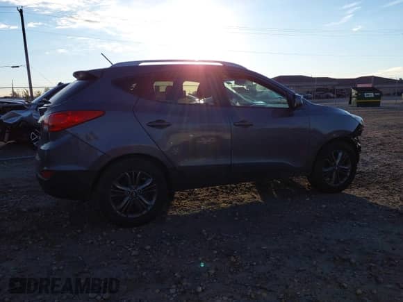 2015 Hyundai Tucson SE with VIN KM8JU3AGXFU050794, listed as a IAAI auction lot 43440138 with 161,385 mi miles and . Bid and sale history available at DreamBid. Image 14.