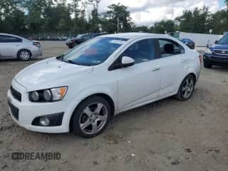 2013 Chevrolet Sonic LTZ с VIN 1G1JE5SG4D4172679, выставлен на аукционе Copart как лот 71161245 с пробегом 158 691 миль миль и Списание • Salvage title. История ставок и продаж доступна на DreamBid. Изображение 1.